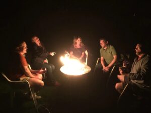 gathering around fire
